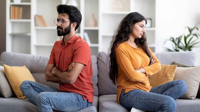 A couple sitting angry with each other